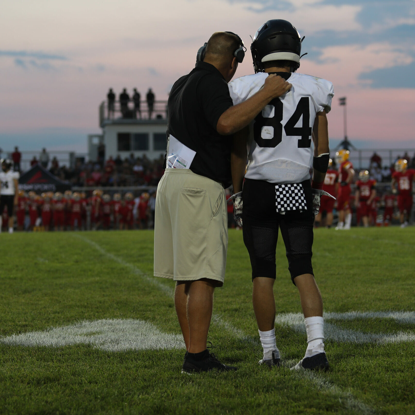 Larry Cox, the Franklin head coach, gives a play call to Junior Creager. Fenwick hosted the Franklin Wildcats, in week one of high school football. Fenwick won the game 14 to 2.